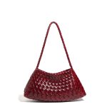 A dark brown woven vegan leather underarm bag with a thin braided strap and decorative side ties ending in leather tabs. Additional product view 5.