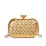 A metallic gold woven vegan leather box clutch with a knotted metal clasp and a thin gold snake-chain strap.