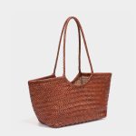 A black woven vegan leather shopper tote with braided handles and a cognac brown drawstring inner pouch. Additional product view 5.