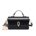 A black vegan leather flap handbag with a quilted lower panel, gold oval clasp, top handle, and a tan furry bag charm. Additional product view 2.