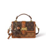 A beige and tan monogram satchel with a top handle, gold buckle, teddy-bear charm, and two detachable shoulder straps. Additional product view 2.