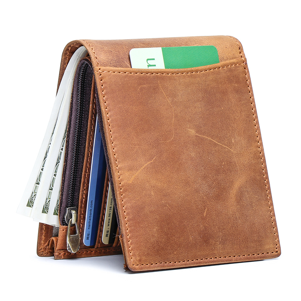 A vintage brown distressed leather bifold wallet standing upright with an outer card slot, zip coin pocket, and cash compartment.