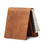 A vintage brown distressed leather bifold wallet standing upright with an outer card slot, zip coin pocket, and cash compartment. Additional product view 2.